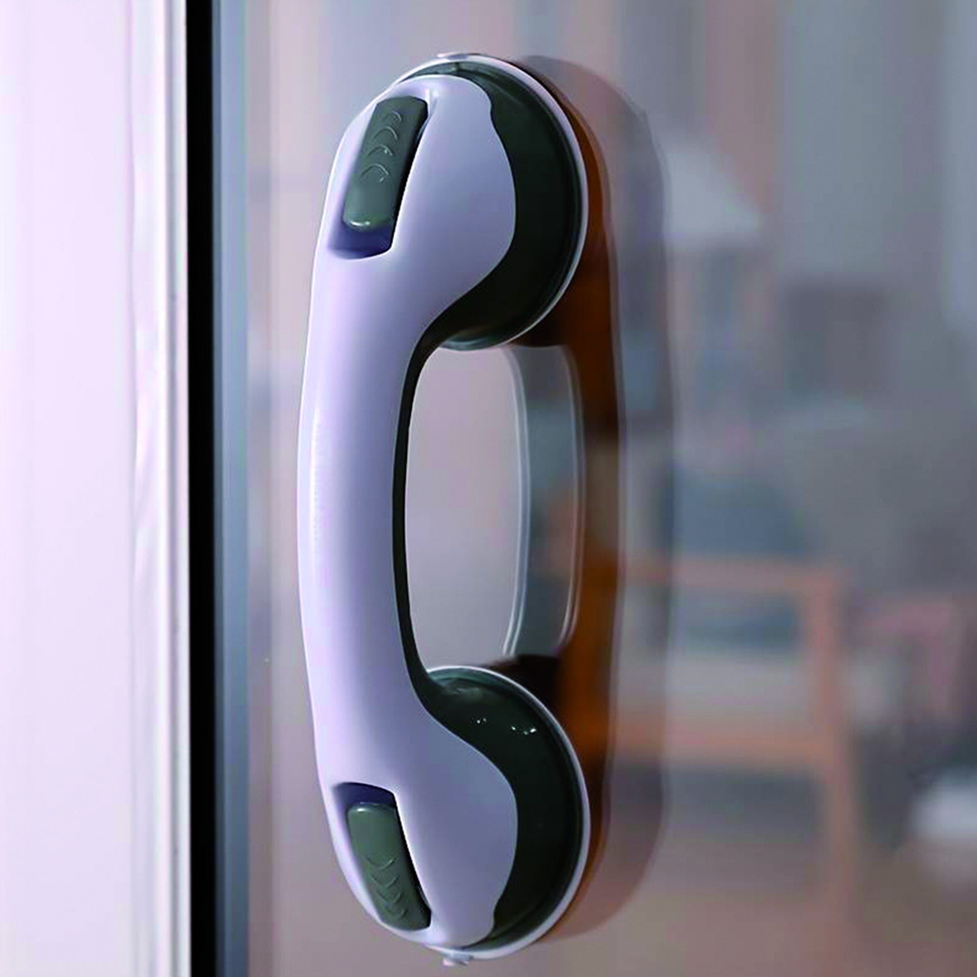 Asidero de baño con ventosas instalado en puerta de cristal