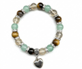 Pulsera de Ojo de Tigre Natural con Colgante de Corazón: Estilo y Calidez