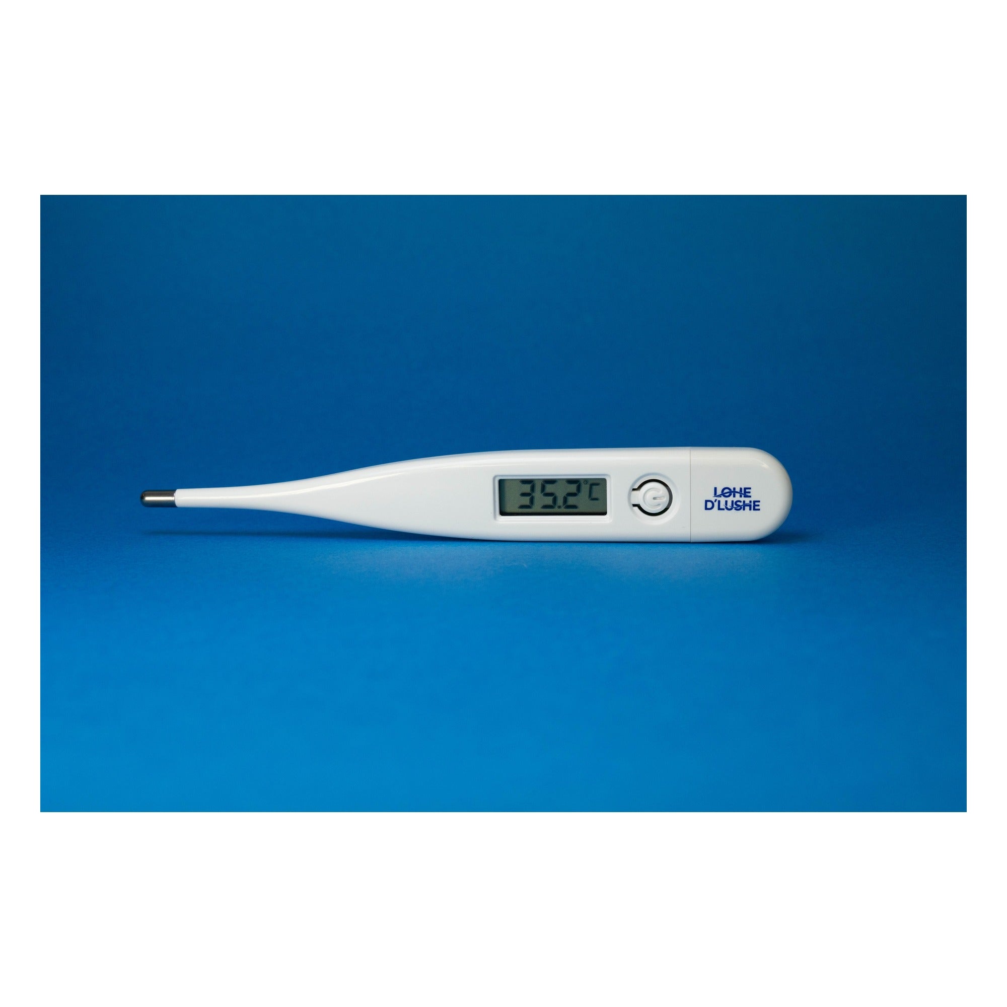 Termómetro digital con marca Lohe D´Lushe grabada, mostrando pantalla LCD